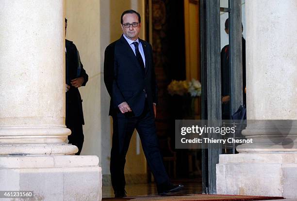 French President Francois Hollande leaves the Elysee Palace after holding a crisis meeting on January 9, 2015 in Paris, France. Both sieges in France...