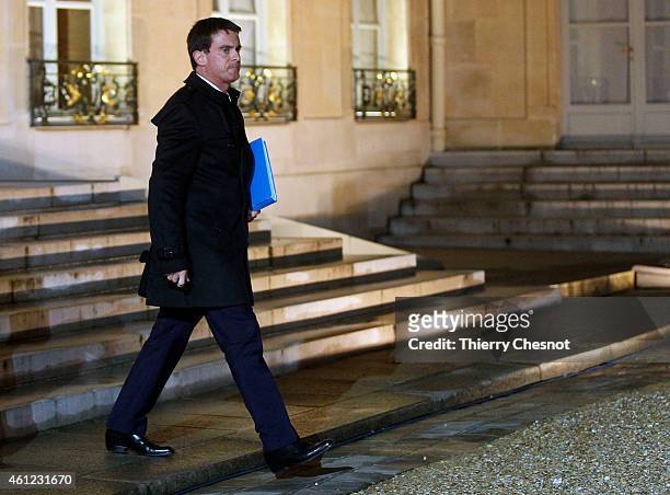 French Prime Minister Manuel Valls leaves the Elysee Palace after a crisis meeting at the Elysee Palace on January 9 in Paris, France. Both sieges in...