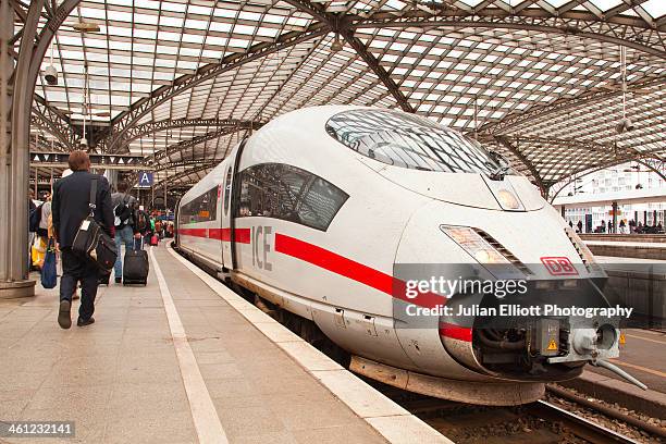 a german ice high speed train in cologne station. - ice-zug stock-fotos und bilder