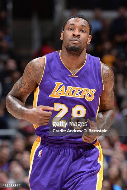Tarik Black of the Los Angeles Lakers runs up court against the Los Angeles Clippers at STAPLES Center on January 07, 2015 in Los Angeles,...