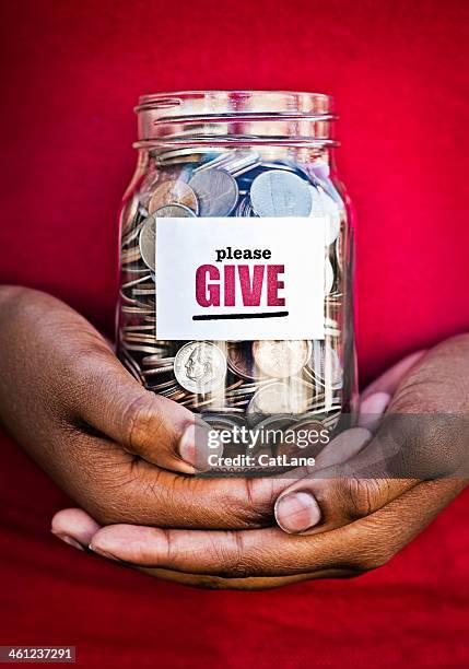 hands holding donation jar - donate money stock pictures, royalty-free photos & images