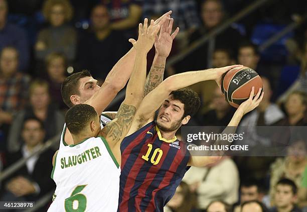 Barcelona's forward Alex Abrines vies with Panathinaikos Athens' guard AJ Slaugther during the Euroleague basketball match FC Barcelona vs...