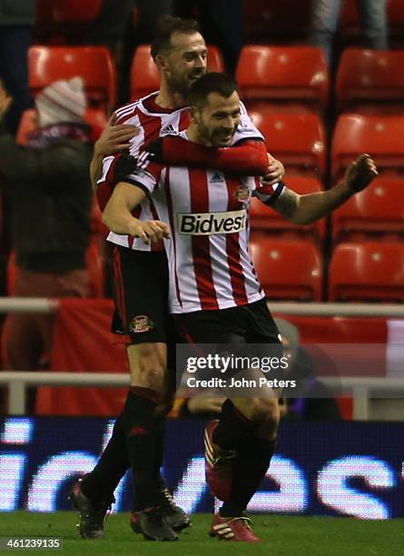 Phil Bardsley of Sunderland celebrates Ryan Giggs of Manchester United scoring an own-goal during the Capital One Cup Semi-Final first leg between...