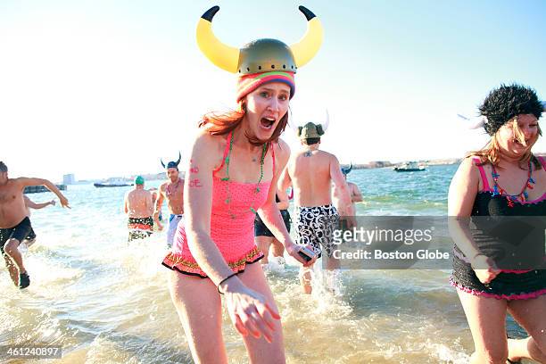 Hundreds of half-naked revelers stampeded into the Boston Harbor for the annual L Street Brownies New Years Day Swim on Wednesday, January 1, 2014.