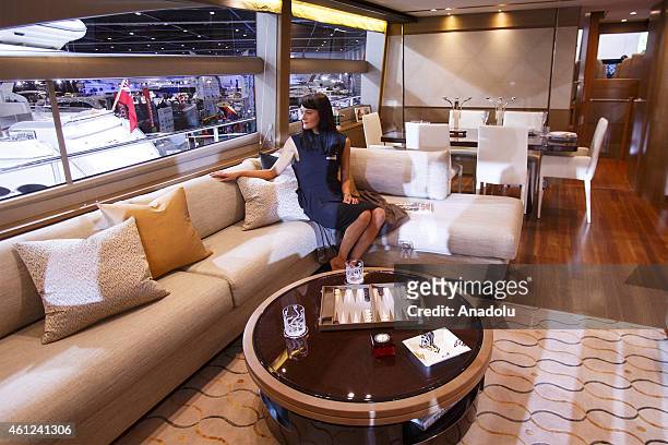An employee showcases Princes 82 motor yacht at the London Boat Show at ExCel on January 9, 2015 in London, England. Until the 18th of January the...