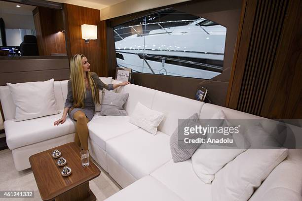 An employee showcasing a Sunseeker motor yacht's interior at the London Boat Show at ExCel on January 9, 2015 in London, England. Until the 18th of...
