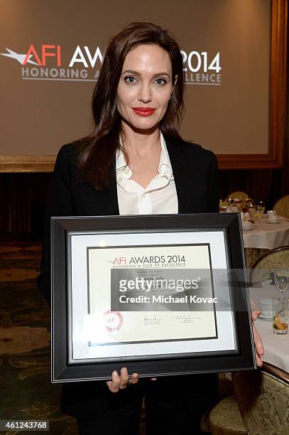 Actor-director Angelina Jolie poses with award during the 15th Annual AFI Awards Luncheon at Four Seasons Hotel Los Angeles at Beverly Hills on...