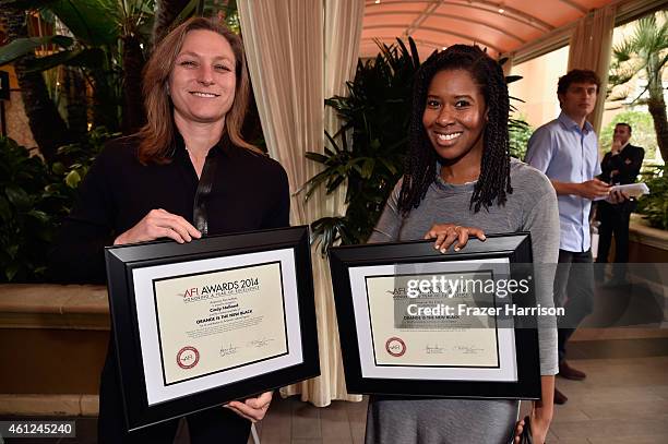 Producers Cindy Holland and Tara Duncan pose with awards during the 15th Annual AFI Awards at Four Seasons Hotel Los Angeles at Beverly Hills on...