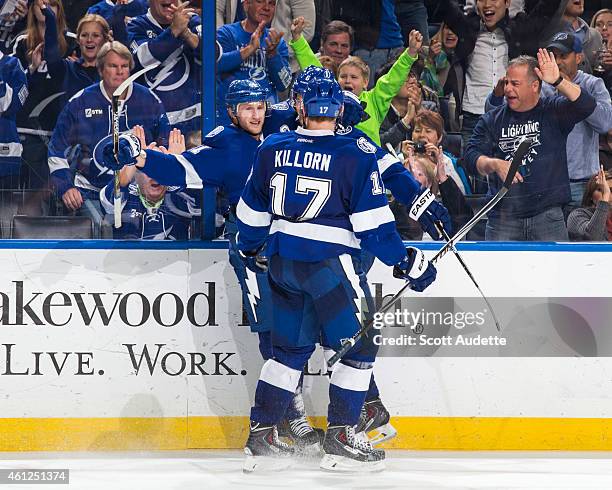Steven Stamkos of the Tampa Bay Lightning celebrates his goal with teammates during the third period against the Buffalo Sabres at the Amalie Arena...