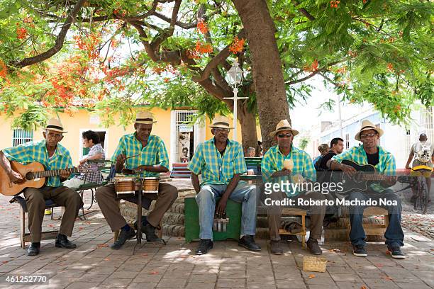 Cuban traditional musicians playing songs for tourists in Trinidad which is the eight village founded in Cuba by Spanish colonizers and a UNESCO...