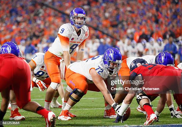 Quarterback Grant Hedrick of the Boise State Broncos prepares to snap the football during the second quarter of the Vizio Fiesta Bowl against the...