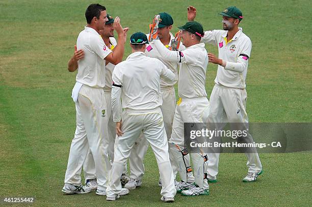 Josh Hazlewood of Australia celebrates after taking the wicket of Murali Vijay of India during day five of the Fourth Test match between Australia...