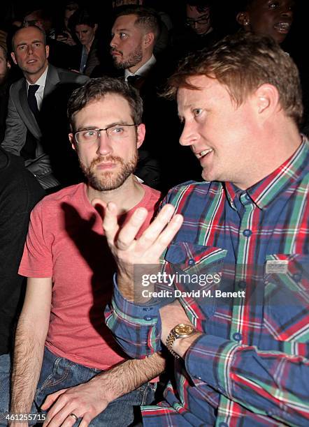 Beardyman and manager Adam Dewhurst sit in the front row during the Superdry AW14 catwalk event as part of London Collections: Men at The Old Sorting...