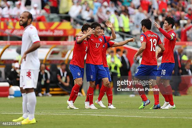 Korea Republic players celebrate after a goal by Cho Young Cheol during the 20145 Asian Cup match between Korea Republic and Oman at Canberra Stadium...