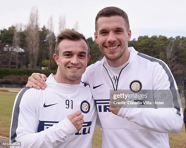 Lukas Podolski and Xherdan Shaqiri pose for a photo during the FC Internazionale Training Session at Appiano Gentile on January 10, 2015 in Como,...