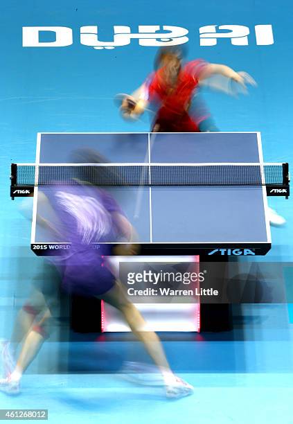 Yuling Zhu of China in action against Tianwei Feng of Singapore during the semi finals of the 2015 IFFT World Team Cup at the Al Nasr Stadium on...