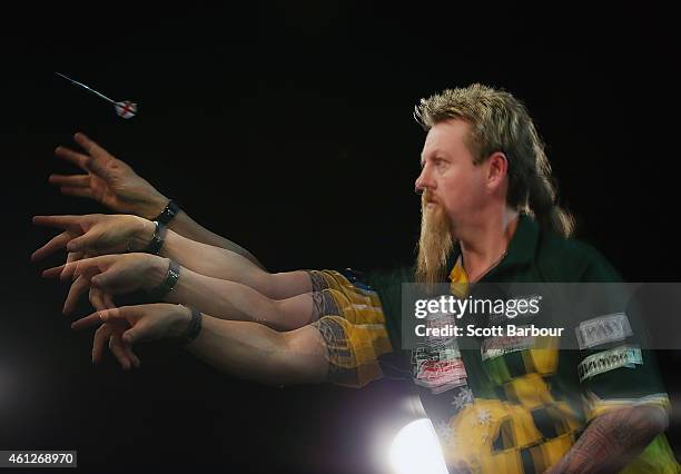 Simon Whitlock of Australia in action during the final between Simon The Wizard Whitlock and Mighty Michael van Gerwen during the Invitational Darts...