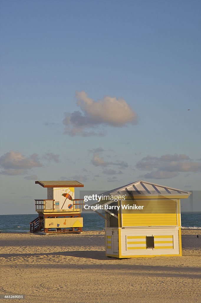 Golden sun hitting beach structures and sand