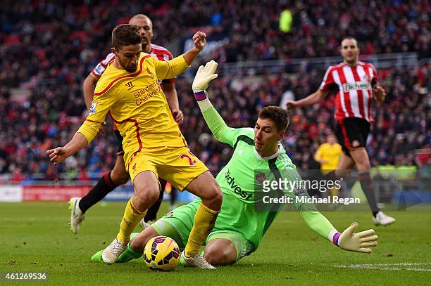 Fabio Borini of Liverpool rounds Costel Pantilimon of Sunderland but fails to score during the Barclays Premier League match between Sunderland and...