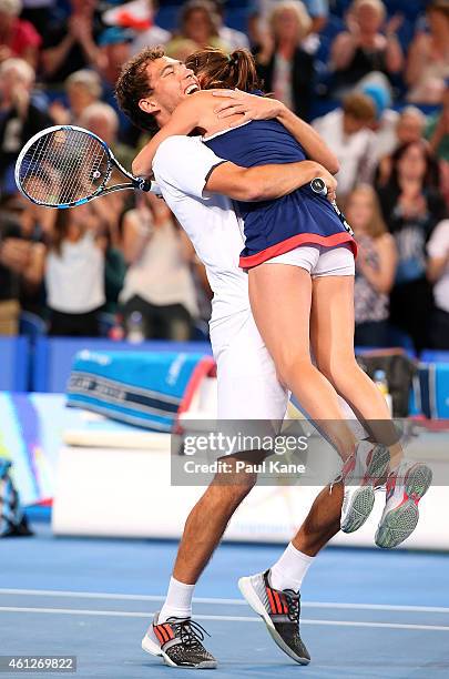 Jerzy Janowicz and Agnieszka Radwanska of Poland celebrate after defeating Serena Williams and John Isner of the United States in the final during...