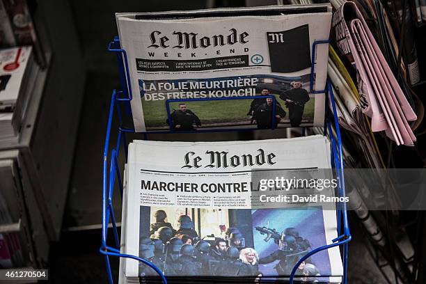 Copy of 'Le Monde' and the 'Courier International' with front page reports on this weeks' terrorist attacks are displayed on a newsstand on January...