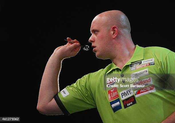 Michael van Gerwen in action during the final between Simon The Wizard Whitlock and Mighty Michael van Gerwen during the Invitational Darts Challenge...