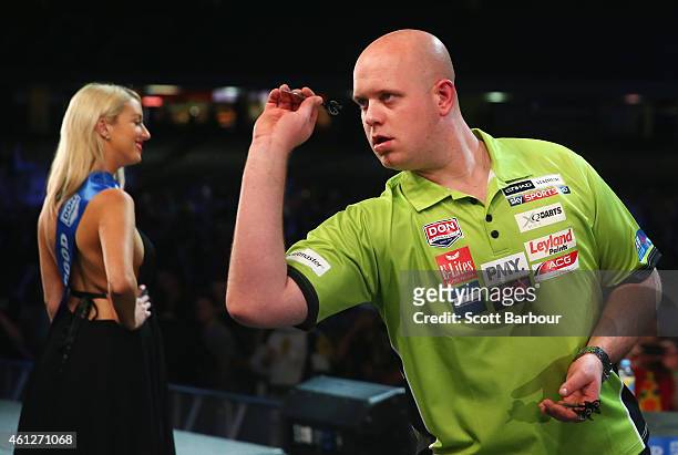 Michael van Gerwen of Holland in action during the final between Simon The Wizard Whitlock and Mighty Michael van Gerwen during the Invitational...
