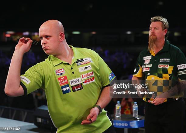 Michael van Gerwen of Holland in action during the final between Simon The Wizard Whitlock and Mighty Michael van Gerwen during the Invitational...