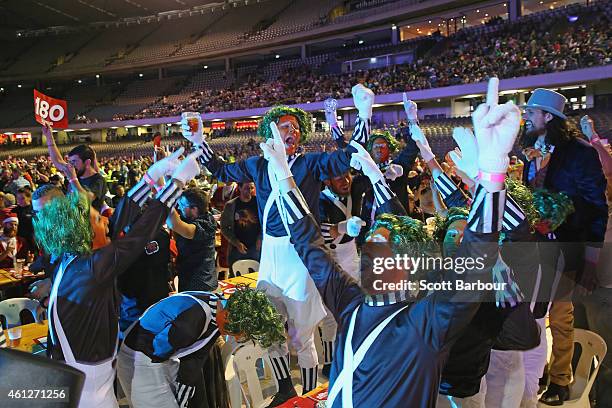 Spectators in fancy dress celebrate in the crowd during the Invitational Darts Challenge at Etihad Stadium on January 10, 2015 in Melbourne,...