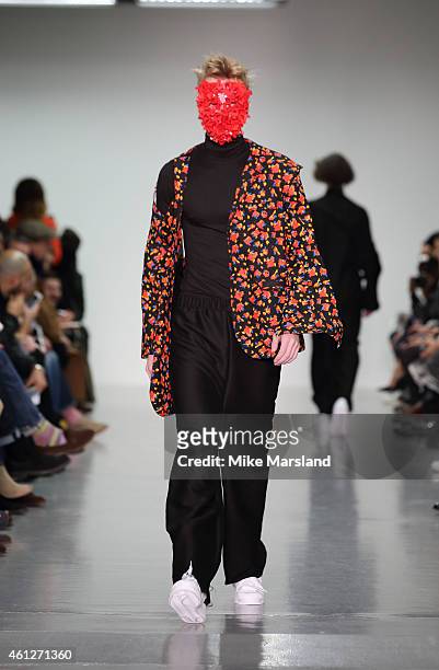 Model walks the runway during the Matthew Miller show at the London Collections: Men AW15 at Victoria House on January 10, 2015 in London, England.