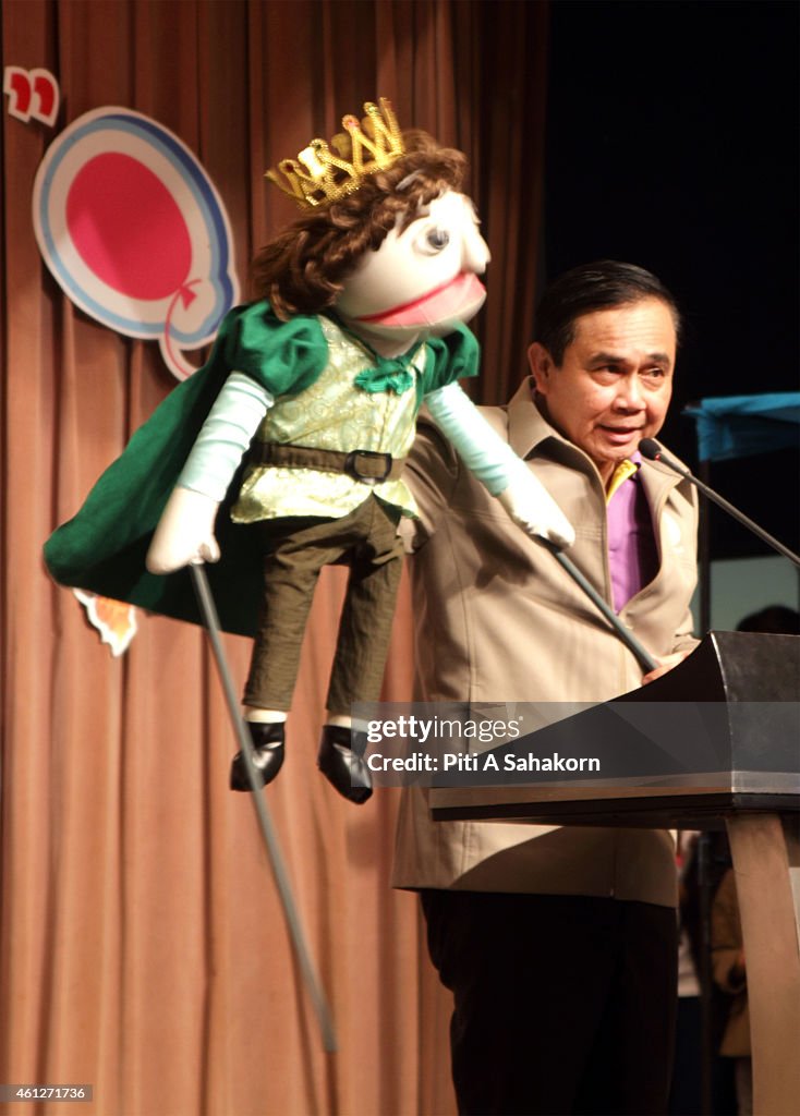 Prime Minister Prayut Chan-o-cha use a puppet to speak with...