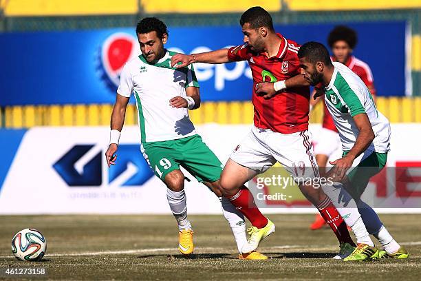 Al-Masry's Abdallah Said vies with al-Ahly's Ahmed Samir during their Egyptian Premier League football match on January 10, 2015 in the Red Sea city...