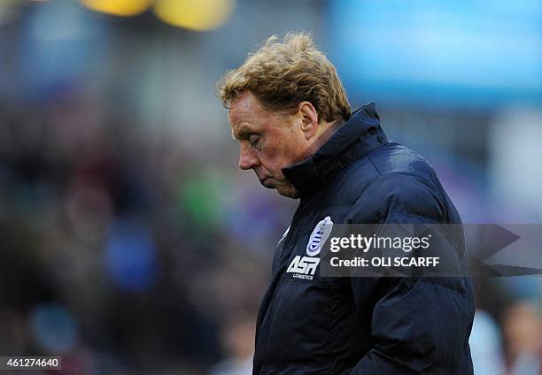 Queens Park Rangers' English manager Harry Redknapp leaves the pich at the end of the first half in the English Premier League football match between...