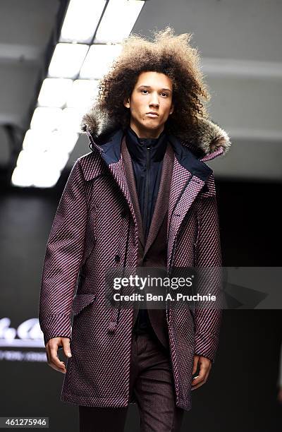 Model walks the runway during the Hardy Amies show at the London Collections: Men AW15 at on January 10, 2015 in London, England.