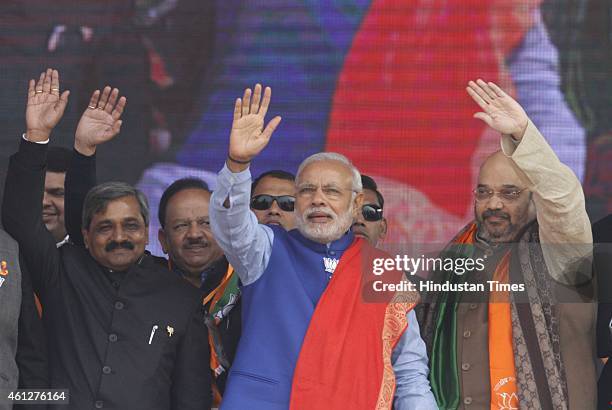 Prime Minister Narendra Modi, BJP President Amit Shah and BJP Delhi President Satish Upadhyay during the 'Abhinandan rally' at Ramlila Maidan, on...