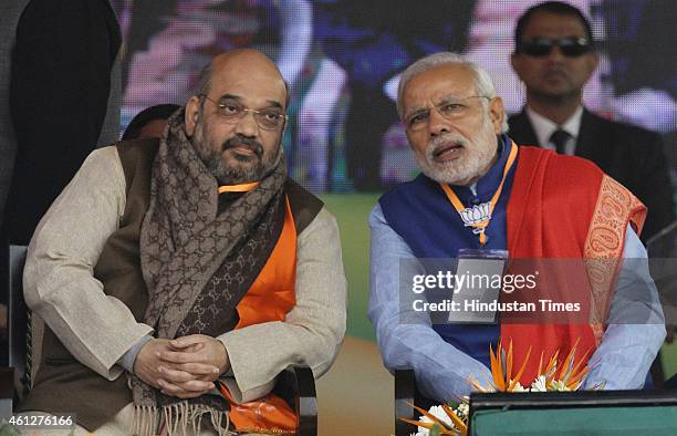 Prime Minister Narendra Modi and BJP President Amit Shah during the 'Abhinandan rally' at Ramlila Maidan, on January 10, 2015 in New Delhi, India....