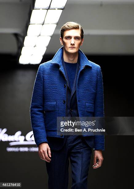 Model walks the runway during the Hardy Amies show at the London Collections: Men AW15 at on January 10, 2015 in London, England.