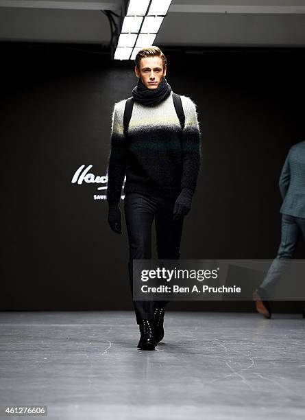 Model walks the runway during the Hardy Amies show at the London Collections: Men AW15 at on January 10, 2015 in London, England.