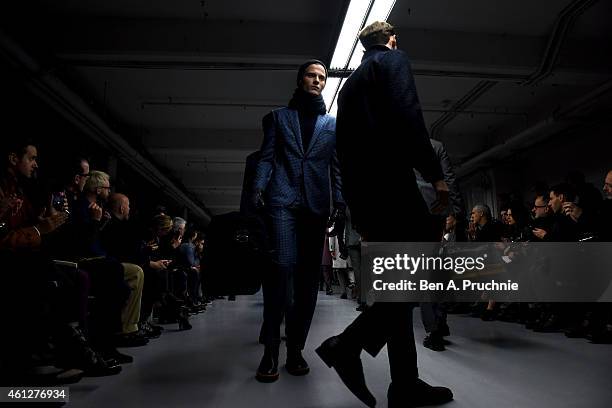 Models walk the runway during the Hardy Amies show at the London Collections: Men AW15 at on January 10, 2015 in London, England.