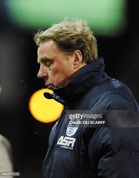 Queens Park Rangers' English manager Harry Redknapp leaves the pitch after the English Premier League football match between Burnley and Queens Park...