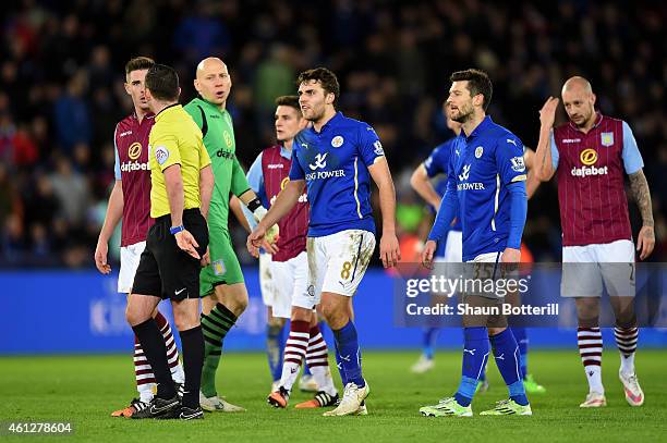 Ciaran Clark of Aston Villa and Matthew James of Leicester City react as they are shown the red card by referee Michael Oliver during the Barclays...