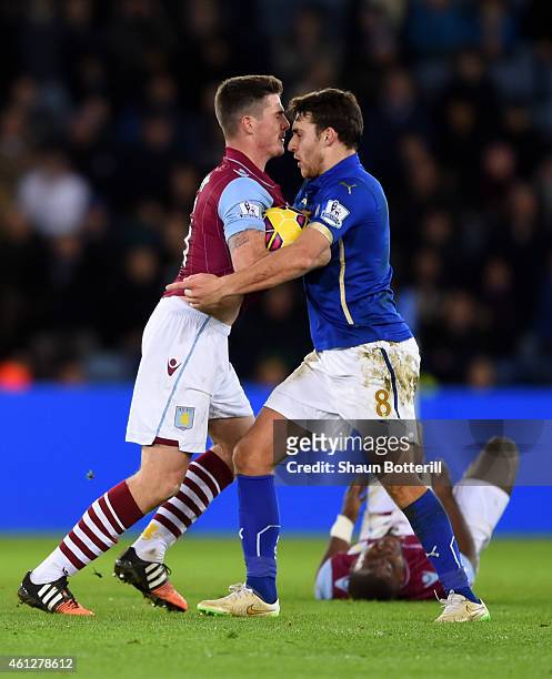 Ciaran Clark of Aston Villa and Matthew James of Leicester City clash following a rash tackle on Jores Okore of Aston Villa during the Barclays...
