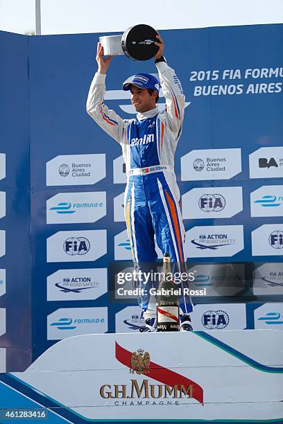 Antonio Felix da Costa of Portugal and Amlin Aguri Formula E Team celebrates at the podium holding the trophy after winning the 2015 FIA Formula E...