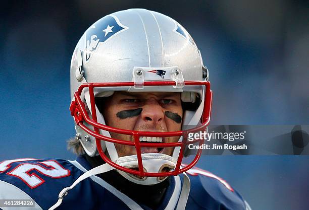 Tom Brady of the New England Patriots warms up before the 2014 AFC Divisional Playoffs game against the Baltimore Ravens at Gillette Stadium on...