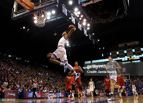 Kelly Oubre Jr. #12 of the Kansas Jayhawks scores on a fast break during the game against the Texas Tech Red Raiders at Allen Fieldhouse on January...