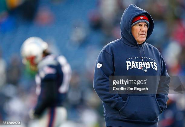 Head coach Bill Belichick of the New England Patriots looks on during warm ups before the 2014 AFC Divisional Playoffs game against the Baltimore...
