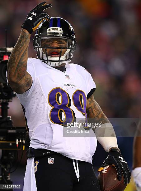 Steve Smith of the Baltimore Ravens celebrates after scoring a touchdown in the first quarter against the New England Patriots during the 2014 AFC...