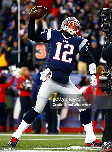 Tom Brady of the New England Patriots celebrates after rushing for a touchdown in the first quarter against the Baltimore avens during the 2014 AFC...