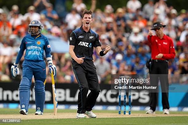 Adam Milne of New Zealand celebrates the wicket of Dimuth Karunaratne of Sri Lanka during the One Day International match between New Zealand and Sri...