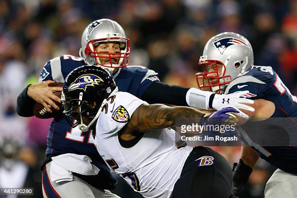 Terrell Suggs of the Baltimore Ravens sacks Tom Brady of the New England Patriots during the first quarter of the 2014 AFC Divisional Playoffs game...